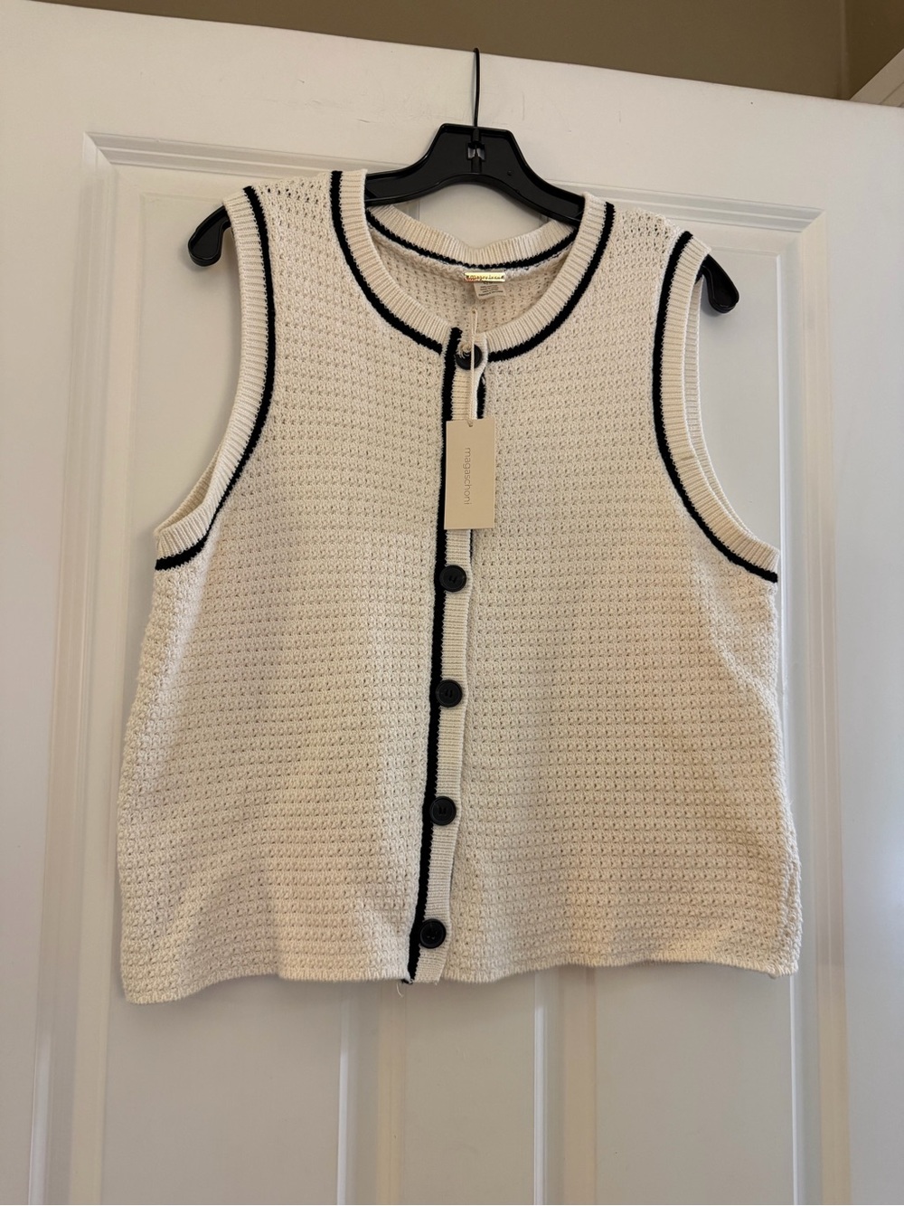 Magaschoni Sleeveless Knit Button-Front sweater vest in Cream with Black Trim.